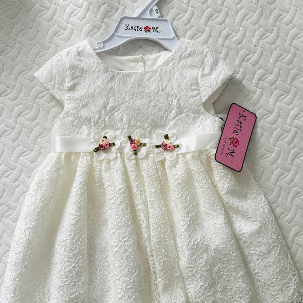 Katie M. Lace Baby Dress with Floral Details